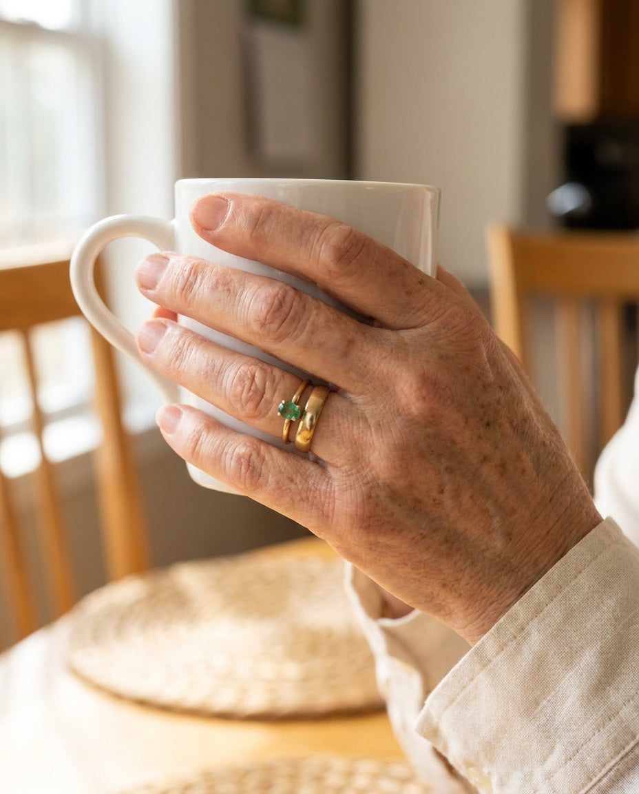 Ring on hand holding coffee
